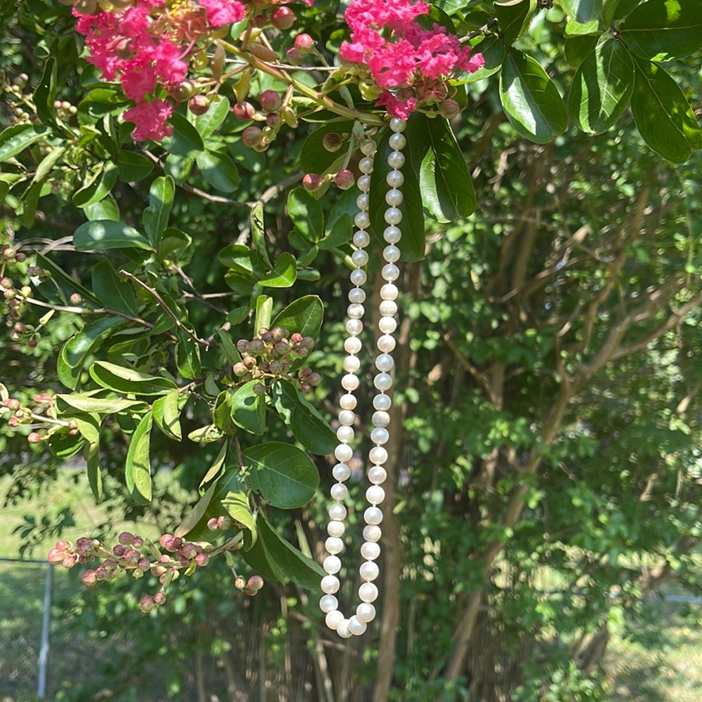 Diamond encrusted earrings and necklace set from Roger & Holland’s